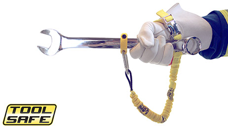 Man holding wrench with ToolSafe® Clamp and Wrist Lanyard.