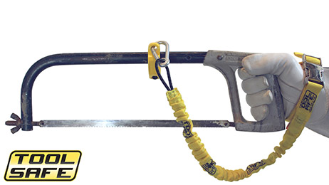 Man holding saw with ToolSafe® Clamp and Wrist Lanyard.