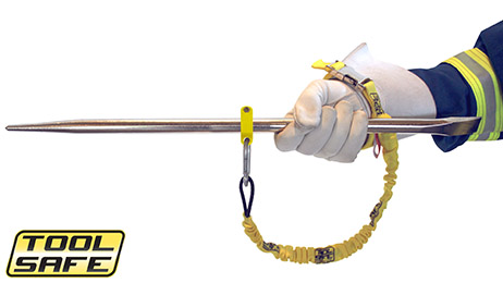 Man holding pin with ToolSafe® Clamp and Wrist Lanyard.