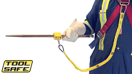 Man holding pin with ToolSafe® Press Block and Harness Lanyard.